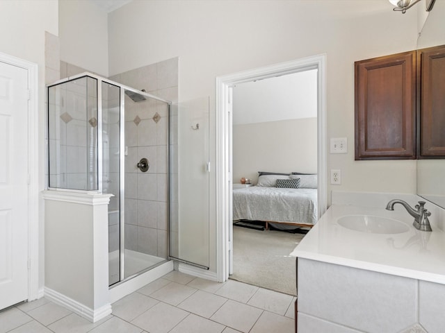 bathroom featuring vanity, tile patterned floors, and a shower with shower door