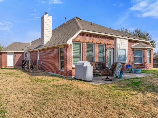 back of house with a patio and a yard