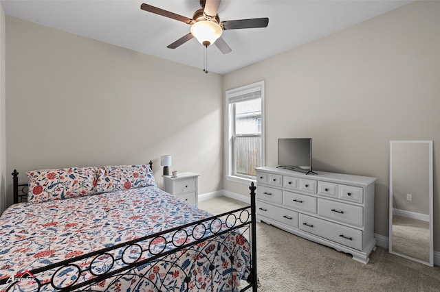 bedroom with ceiling fan and light carpet