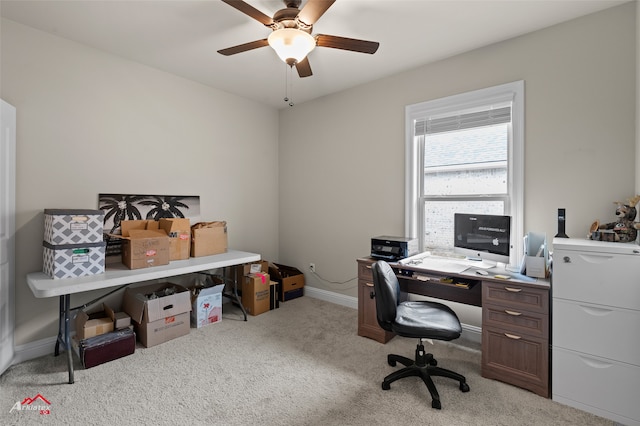 carpeted home office with ceiling fan