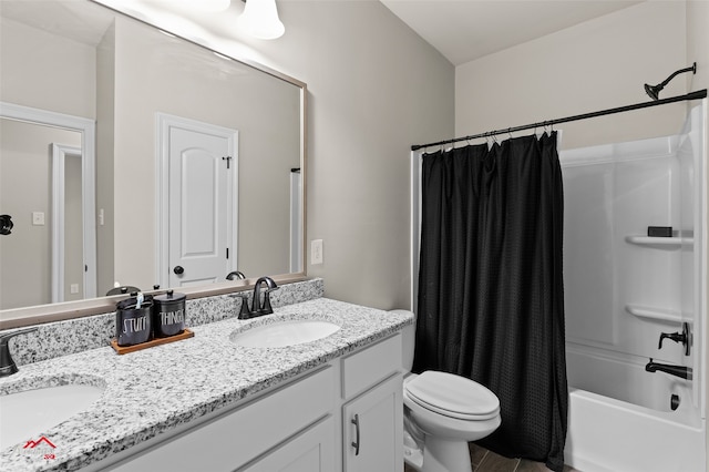 full bathroom featuring toilet, vanity, and shower / bathtub combination with curtain