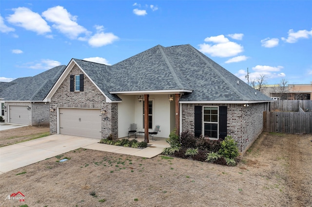 view of front facade with a garage and covered porch