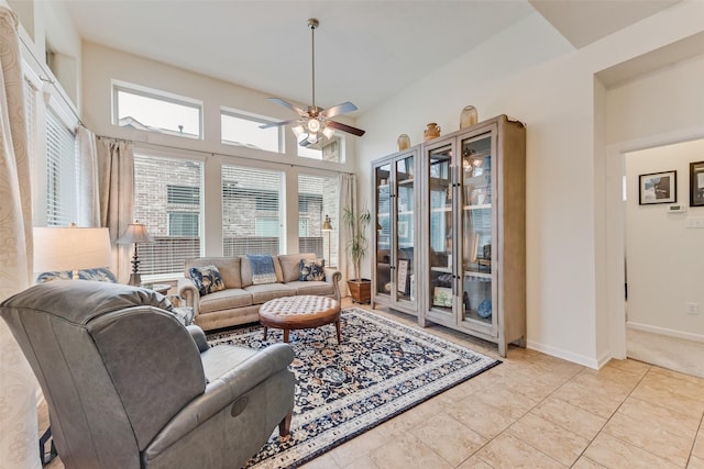 tiled living room featuring ceiling fan