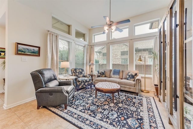 sunroom featuring ceiling fan