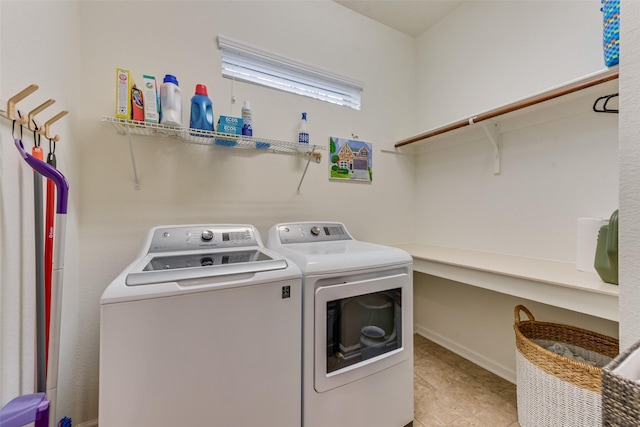 clothes washing area featuring washing machine and clothes dryer