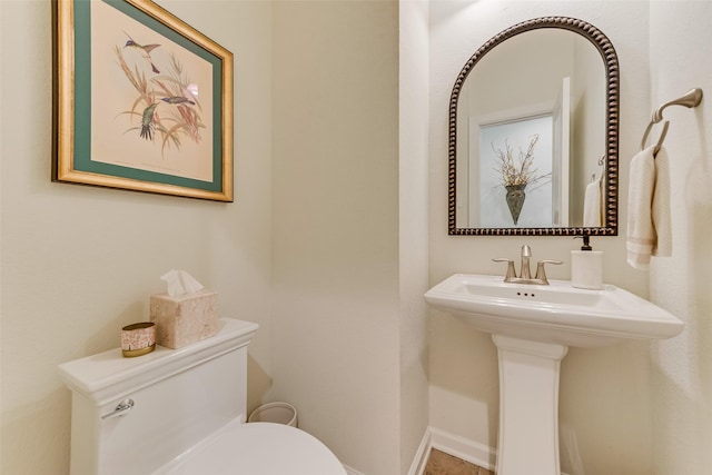 bathroom with sink and toilet