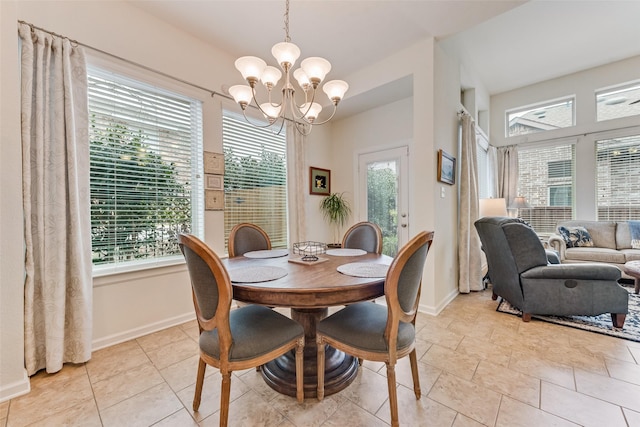 dining space featuring an inviting chandelier