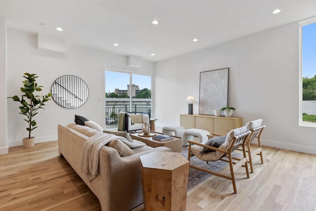 4330 Dickason Ave Unit 201, Dallas, TX 75219 - living room featuring light wood finished floors, recessed lighting, and baseboards
