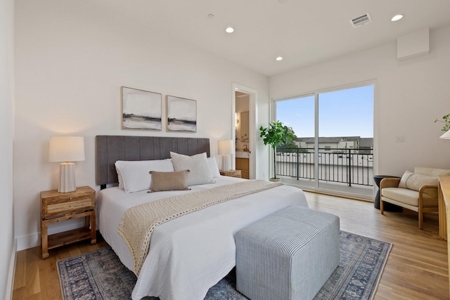4330 Dickason Ave Unit 201, Dallas, TX 75219 - bedroom featuring access to exterior, light wood finished floors, recessed lighting, baseboards, and ensuite bath