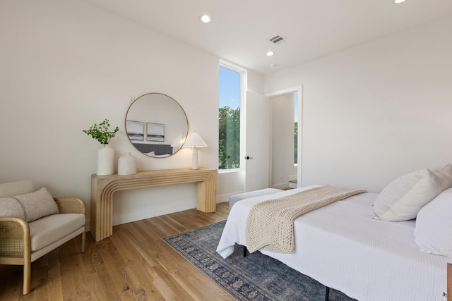 4330 Dickason Ave Unit 201, Dallas, TX 75219 - bedroom featuring wood finished floors, recessed lighting, and baseboards