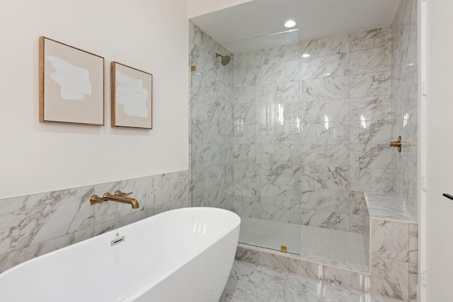 4330 Dickason Ave Unit 201, Dallas, TX 75219 - bathroom with walk in shower, a freestanding bath, marble finish flooring, and recessed lighting