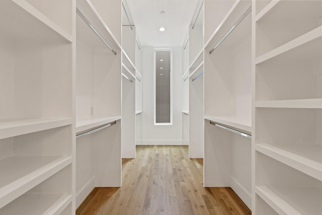 4330 Dickason Ave Unit 201, Dallas, TX 75219 - walk in closet with light wood-style flooring
