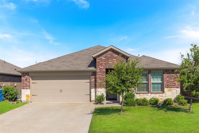 view of front of house featuring a garage and a front lawn