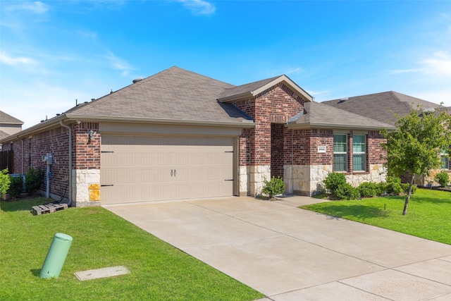 ranch-style house with a garage and a front lawn