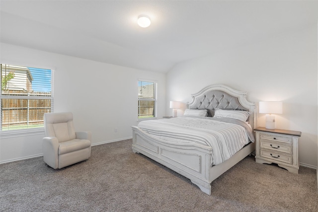 carpeted bedroom featuring vaulted ceiling