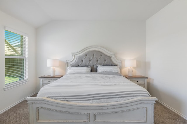 carpeted bedroom featuring vaulted ceiling