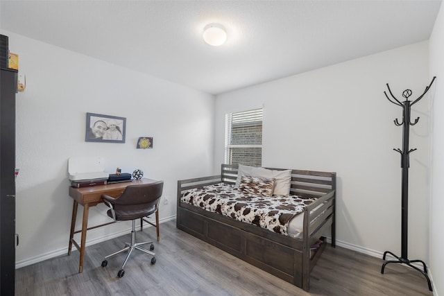 bedroom featuring hardwood / wood-style floors