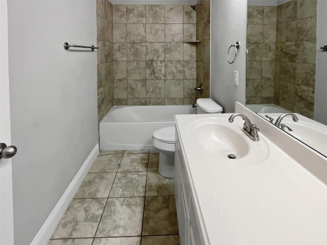 full bathroom featuring tiled shower / bath, tile patterned floors, toilet, and vanity