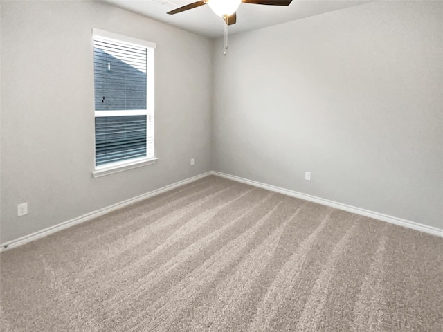 unfurnished room with carpet flooring and ceiling fan