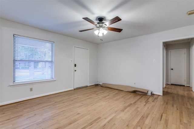 unfurnished room featuring ceiling fan and light wood-type flooring