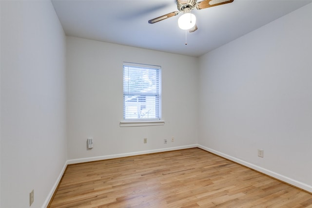 spare room featuring light hardwood / wood-style floors and ceiling fan