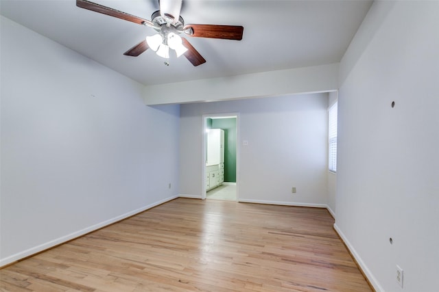 empty room featuring ceiling fan and light wood-type flooring