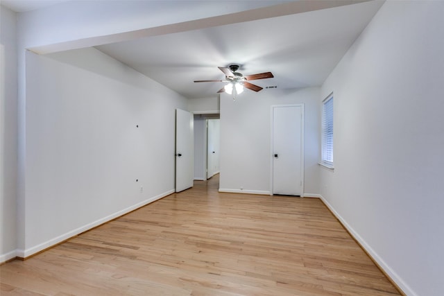 unfurnished room with ceiling fan and light wood-type flooring