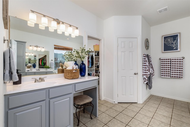 bathroom featuring tile patterned floors and vanity