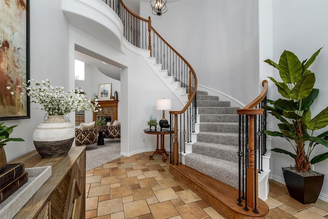 foyer featuring a towering ceiling