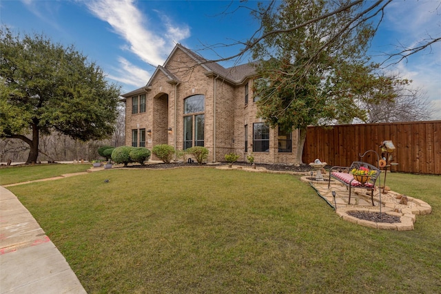 view of front of home with a front lawn