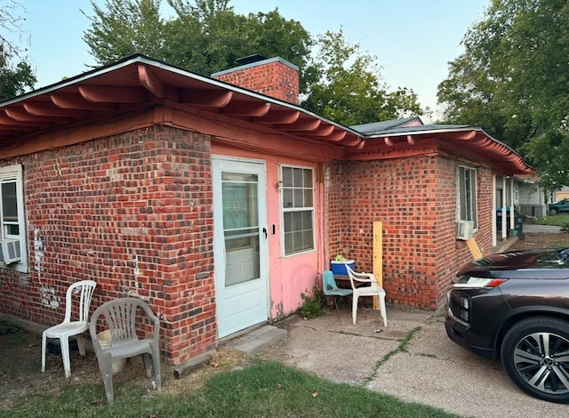 view of side of home featuring a patio