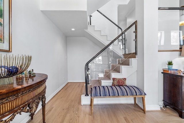 stairs featuring wood-type flooring