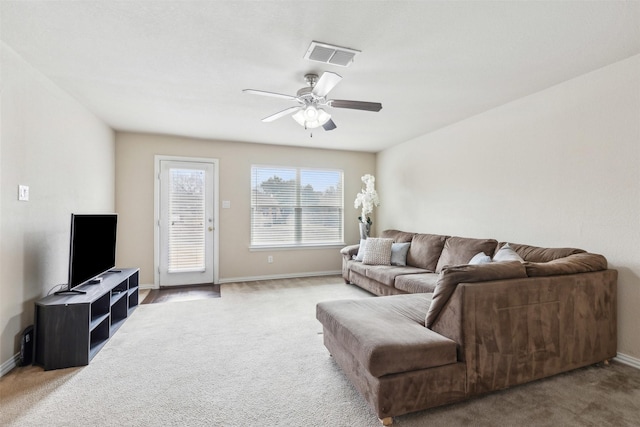 living room featuring ceiling fan and carpet flooring