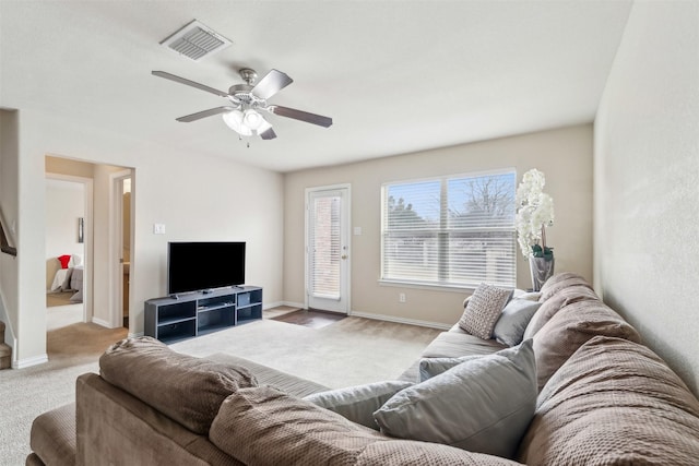 carpeted living room featuring ceiling fan