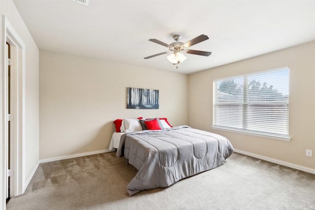 carpeted bedroom featuring ceiling fan