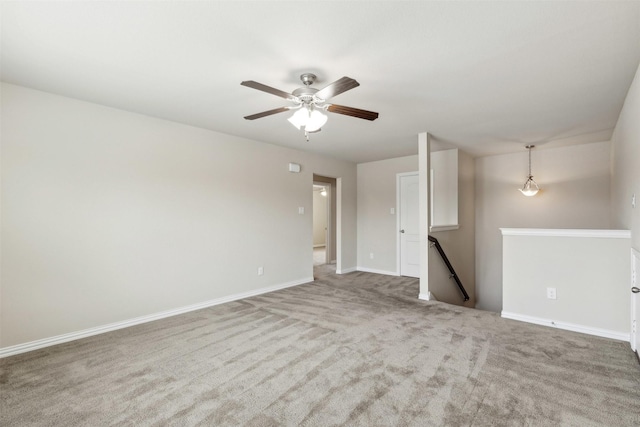 empty room with carpet floors and ceiling fan