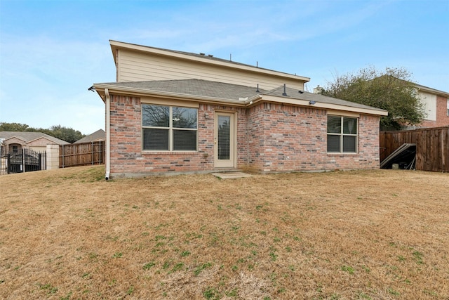 rear view of house with a lawn