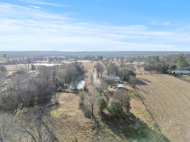 birds eye view of property with a rural view