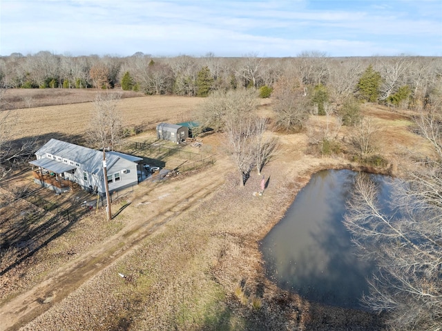 birds eye view of property with a water view and a rural view