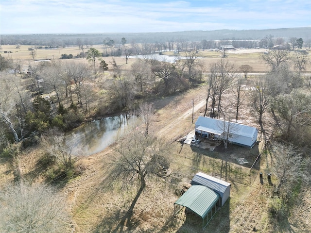 birds eye view of property with a rural view and a water view