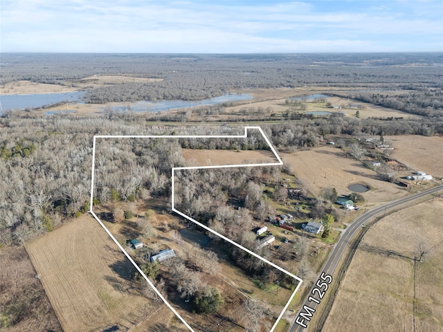 birds eye view of property featuring a water view and a rural view