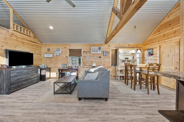 bedroom featuring an AC wall unit, wood walls, hardwood / wood-style flooring, a raised ceiling, and wooden ceiling