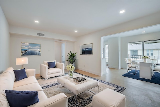 living room with light hardwood / wood-style floors