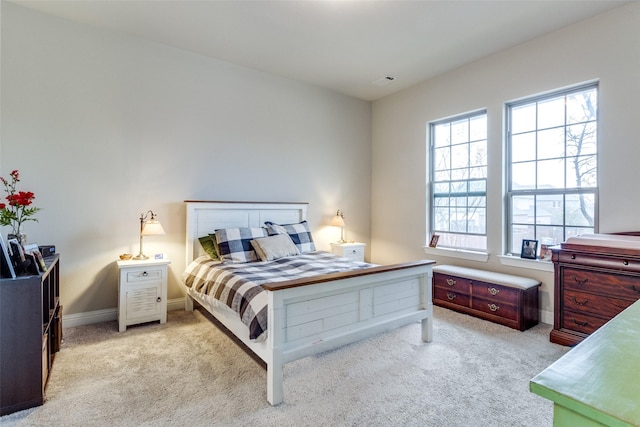 bedroom featuring light colored carpet