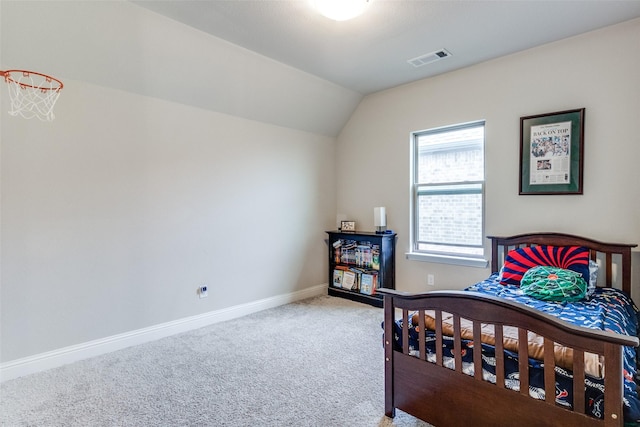 carpeted bedroom featuring lofted ceiling