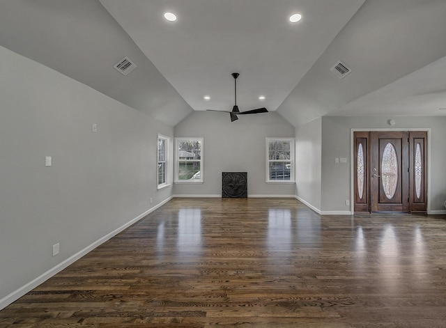 unfurnished living room with ceiling fan, lofted ceiling, and dark hardwood / wood-style flooring