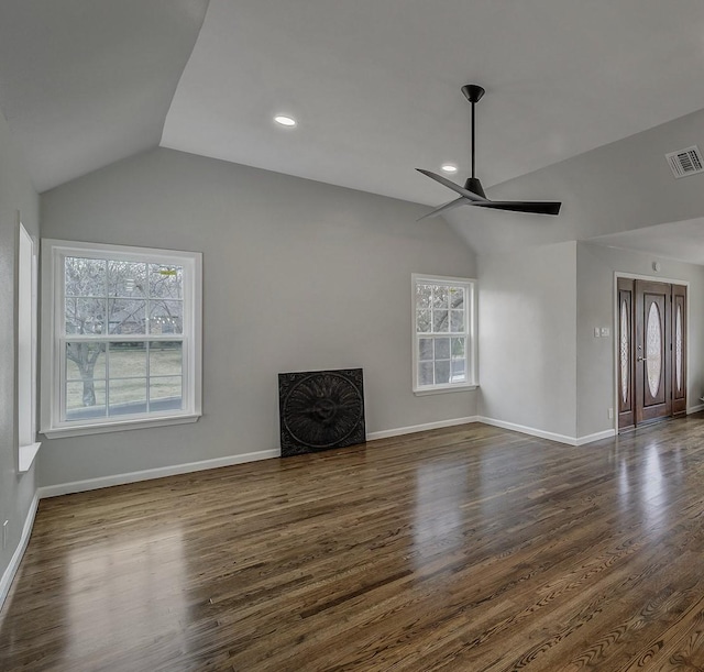 unfurnished living room with lofted ceiling, dark hardwood / wood-style flooring, and ceiling fan