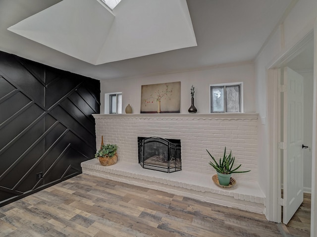 living room with hardwood / wood-style flooring and a fireplace