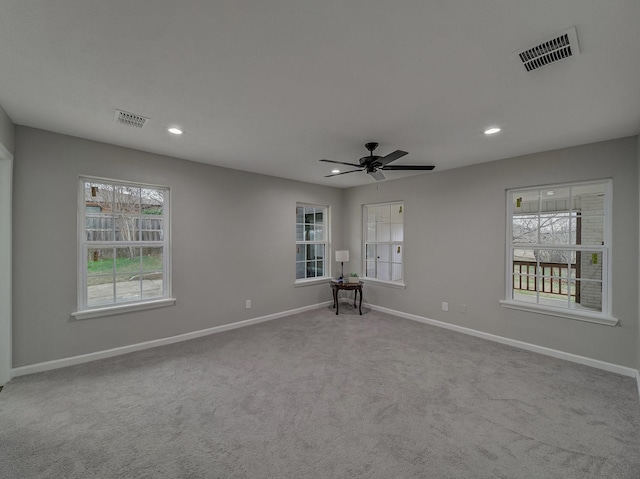 carpeted empty room with ceiling fan