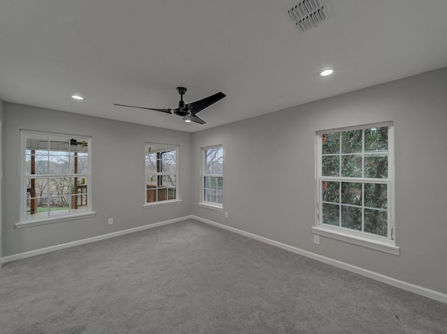 carpeted empty room with ceiling fan